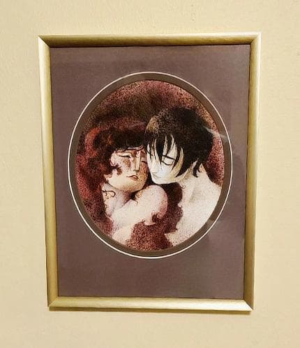 Framed painting for Love and Tranquility hung on a wall.